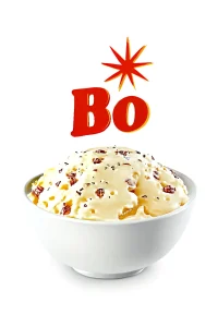 The image features a bowl of creamy mashed potatoes topped with smooth gravy and crispy bacon bits, set against a clean white background. The bowl is simple and white, and the mashed potatoes have a rich, velvety texture. Above the bowl, the bold red "Bo" lettering with a starburst graphic adds a vibrant touch to the composition.
Bojangles menu