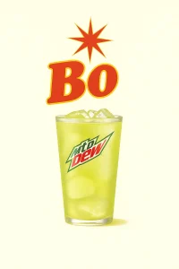 "A refreshing glass of Mountain Dew filled with ice cubes, featuring the mountain Dew logo on the glass. The drink is set against a light off-white creamy background, with the word 'Bo' in bold red letters and a starburst above it." Bojangles menu